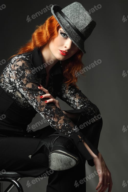 Preview: Portrait Redhead, A Young Woman In Hat. Against A Dark Background. Sexy Look, Lush Red Lips
