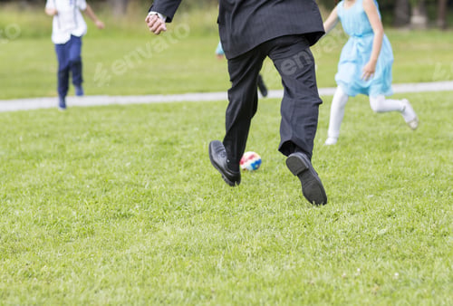 Preview: Grandfathers Are Playing Football Outdoors With Their Grandchildren. Children Are Enjoying The Life.