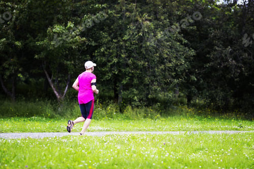 Preview: A Woman Running In The Rain. Image Has A Vintage Effect.