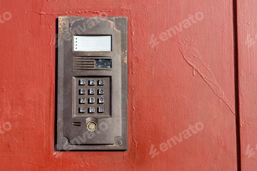Preview: An Intercom On Metall Used Door With A Keypad For Calling Close Up With Copy Space.