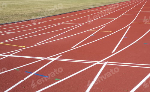 Preview: Running Tracks. An Image Of A New Running Tracks In The Sunshine. Grass Is About To Grow In The