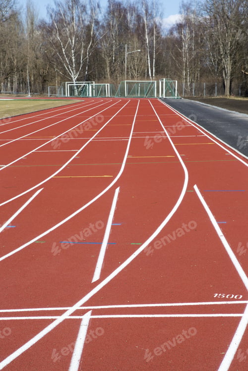 Preview: Running Tracks. An Image Of A New Running Tracks In The Sunshine. Grass Is About To Grow In The