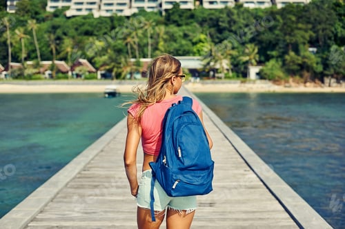 Preview: Rear View Of Hipster Girl Carrying Backpack On Her Back