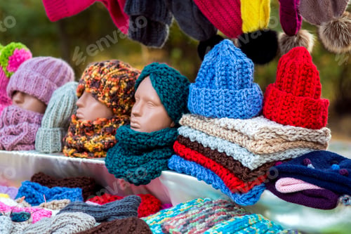 Preview: Counter With Knitted Wool Hats And Colorful Scarves With A Mannequin Head.