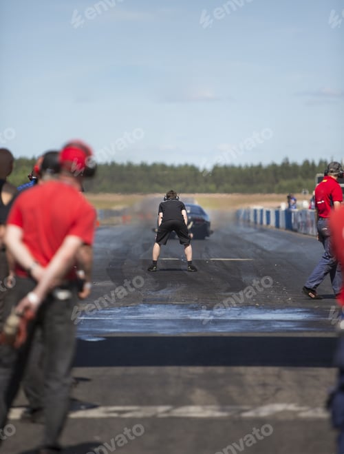 Preview: A Drag Race Car Heading Up For Top Speed In The Drag Race Weekend On A Hot Summer Day. A Team