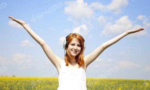 Preview: Redhead Girl With Headphone At Field.