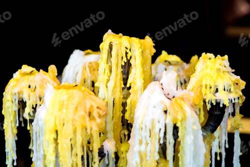 Preview: Melted Burnt Candles With Wax Drips On A Candelabrum In The Dark Background Of A Romantic Cafe