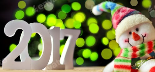 Preview: Christmas Background With Sign 2017 And Snowman On A Green Background. Happy New Year.