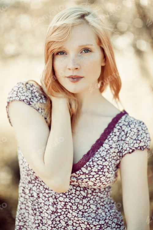 Preview: Portrait Of A Beautiful Blonde Girl In Field