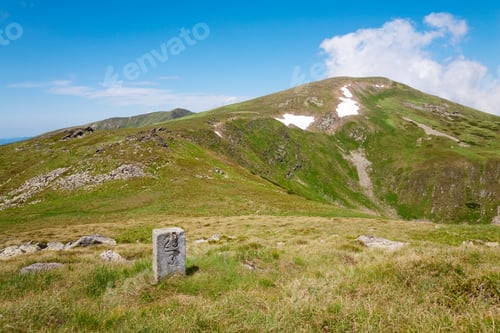 Preview: Stony Post On Summer Mountain Pidge And Snow On Mountainside(Ukraine, Carpathian Mountains)