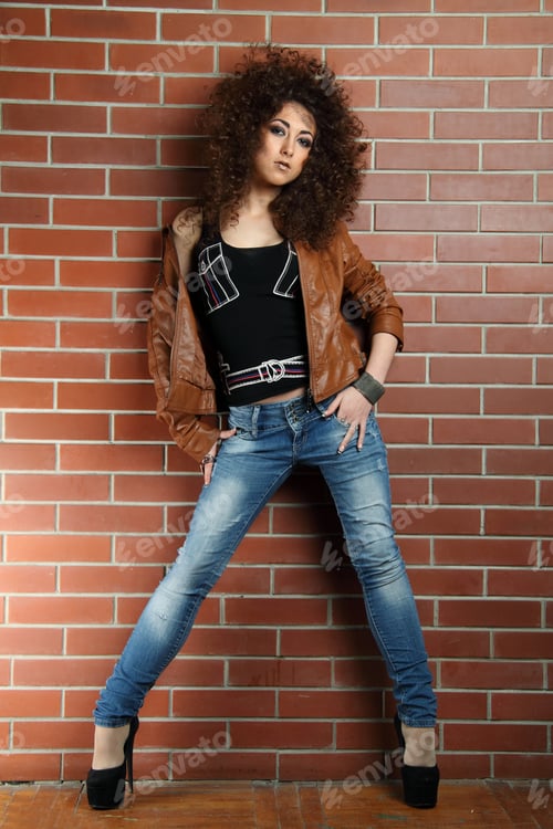 Preview: Beautiful Girl On A Background Of Brick Wall