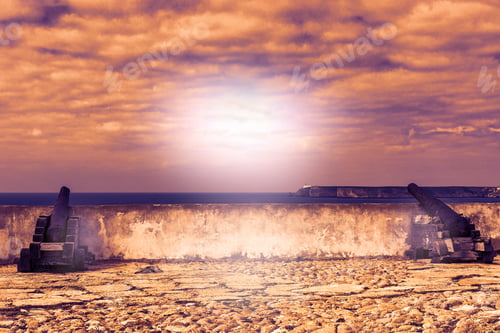 Preview: Old Rusty Cannon Guarding The Portuguese Fortress Sagres On The Atlantic Ocean Beach In The Light
