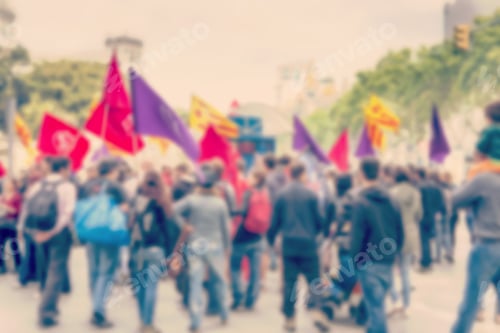 Preview: Crowded Streets. Blurry Image. People Waving Flags In A Demonstration. Image Has A Vintage Effect