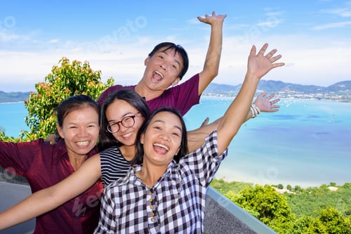 Preview: Family Of Tourists Smiling Are Happy And Show Their Hands Invite To See The Beautiful Landscape Of
