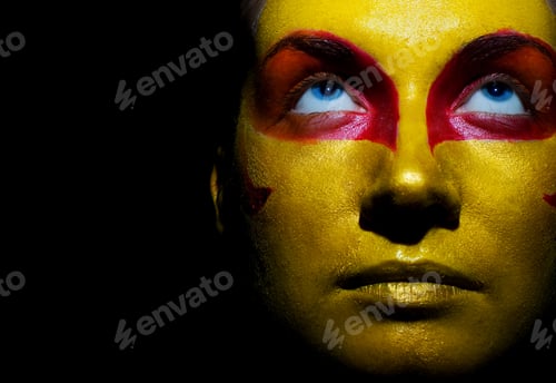 Preview: Portrait Of A Mysterious Woman With Artistic Make-Up On Her Face. Isolated On Black Background