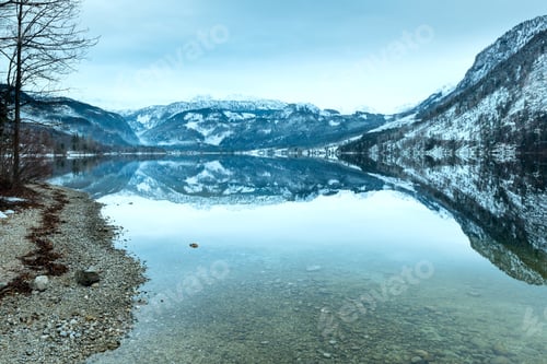 Preview: Cloudy Winter Alpine Lake Grundlsee View (Austria) With Fantastic Pattern-Reflection On The Water
