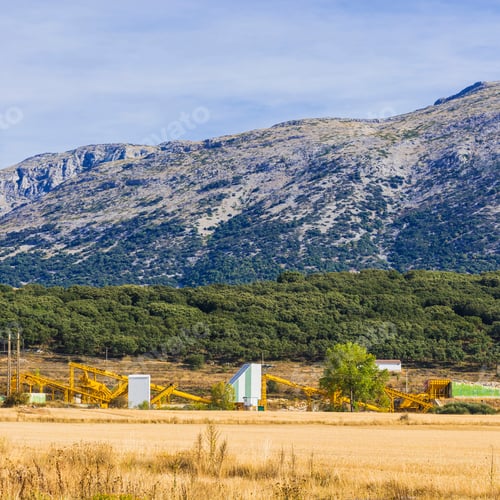 Preview: Industrial Enterprise On The Field In The Cantabrian Mountain, Spain. Spanish Landscape At Sunrise