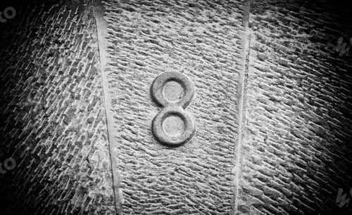 Preview: Number Eight Pair Of Information, Sign Detail On A Stone Wall