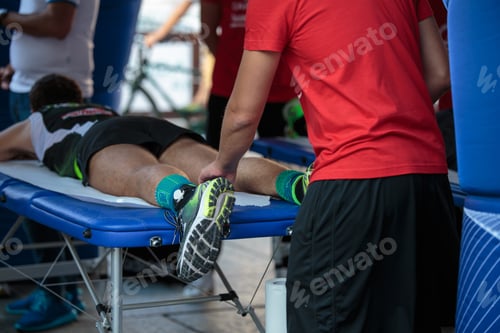 Preview: Athletic Man Receives Leg Massage at Sporting Event