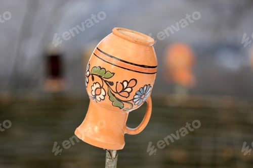 Preview: Ukrainian Clay Jug On A Wooden Fence