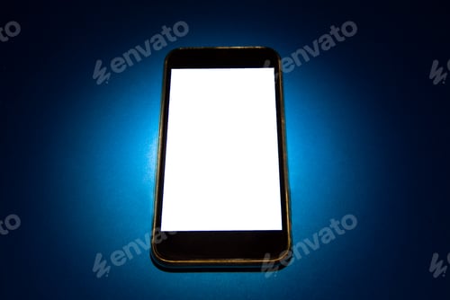 Preview: Mobile Phone With A Blank Screen On The Blue Paper Closeup