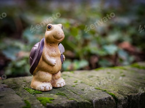 Preview: Small Turtle Figurine Standing On A Wall In The Garden