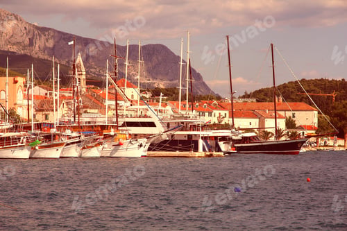 Preview: Croatia - Makarska, Town In Dalmatia. Old Town View With Marina And Biokovo Mountains In Background.