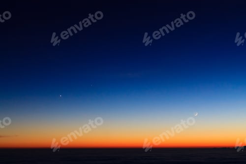 Preview: Mountain Silhouette Over Clouds,Sky At Twilight With Moon