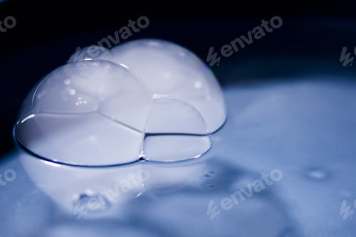 Preview: Abstract Shot With Big Soap Bubbles On A Water Surface With Smoke Inside. Image Has Grain Texture