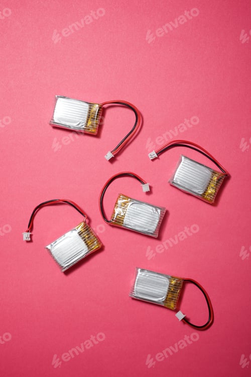 Preview: Drone Batteries On A Pink Table.