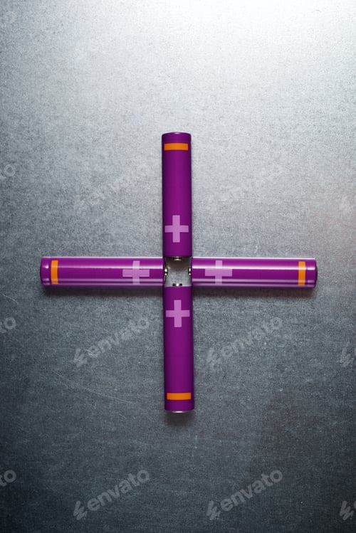 Preview: Four Batteries On A Metal Table.