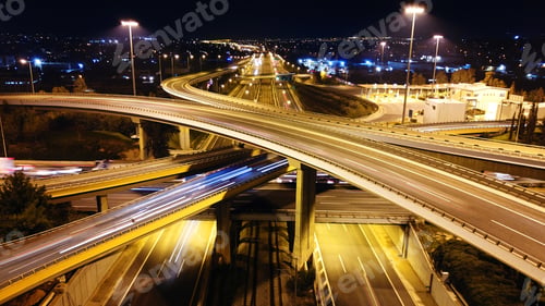 Preview: Aerial Drone Slow Shutter Night Shot Of Urban Elevated Toll Ring Road Junction And Interchange
