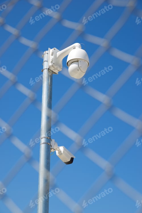 Preview: Closeup Of A Surveillance Camera And Clear Sky.