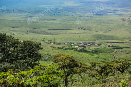 Preview: Masai Village In Ngorongoro Crater. Small Masai Huts In African Savanna, Tanzania