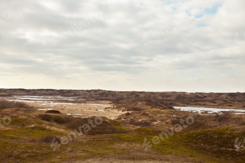 Preview: Grassy Dune Landscape With Little Lakes And Blue Cloudy Sky.