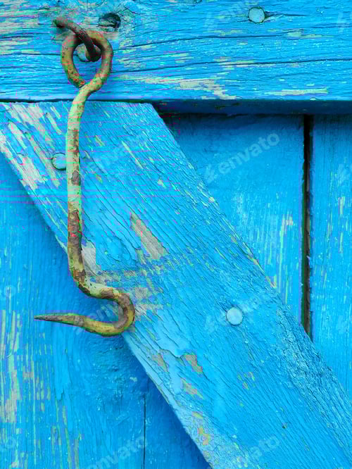 Preview: Rustic blue door with peeling paint and hook