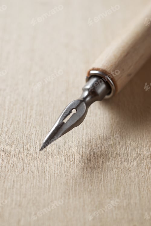 Preview: Nib Pen For Calligraphy On A Wood Table.