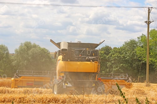 Preview: Combine Harvester At Work In A Field At Harvest