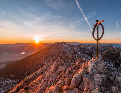 Preview: Male Hiker At The Top Of The Mountain At Sunset.