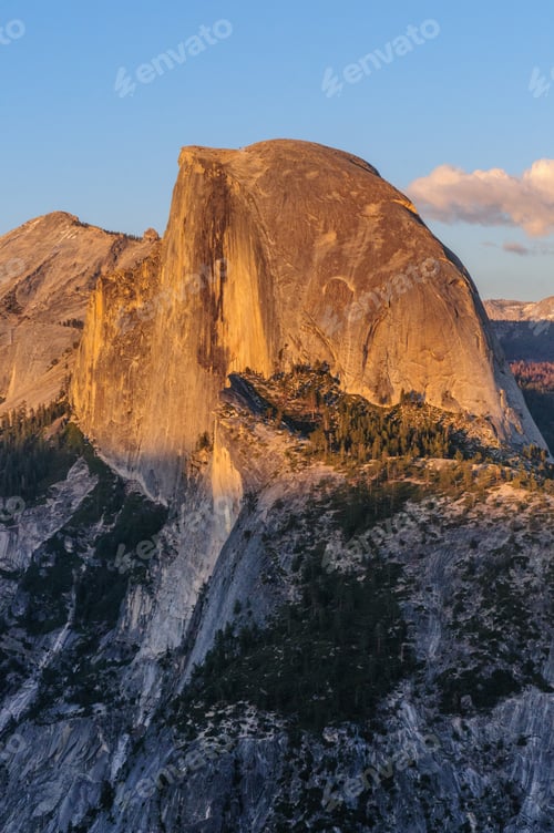 Preview: A Close-Up Of Half Dome. Golden Light From The Sunset Is Cast Upon The Mountain Tops, While The
