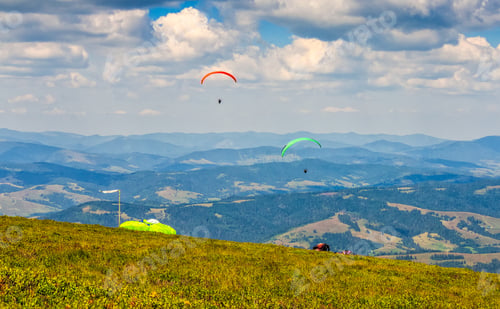 Preview: Skydivers Fly Over The Mountains. Parachute Extreme Sport