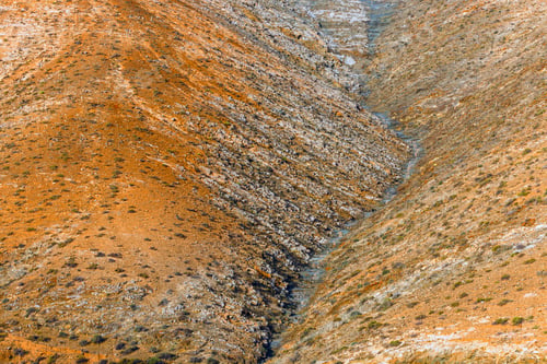 Preview: The View Of The Hills At Sunset On Fuerteventura Island. The Dominant Colour Is Red And Orange