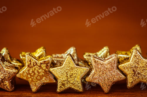 Preview: Group Of Golden Stars On Brown Background