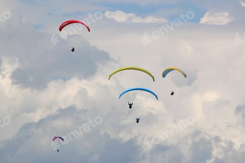 Preview: Paragliders Flying Wings In A Cloudy Sky