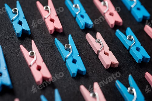 Preview: Small Clothespins On A Black Table.