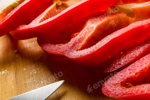 Preview: Sliced Fresh Red Paprika, Bell Pepper On Bamboo Cutting Board