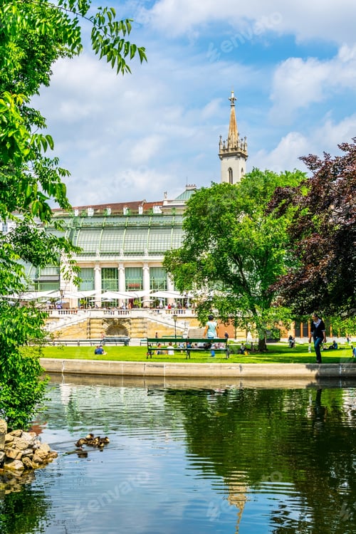 Preview: People Are Walking Around The Famous Palmenhaus Cafe Situated Next To The Hofburg Palace In Vienna