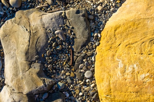 Preview: Boulders And Colorful Pebbles On The Beach