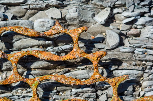 Preview: Very Rusty Metal On A Gray Cracked Rock