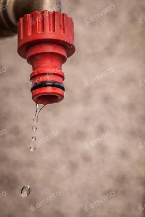 Preview: Water Dripping From The End Of A Hose.